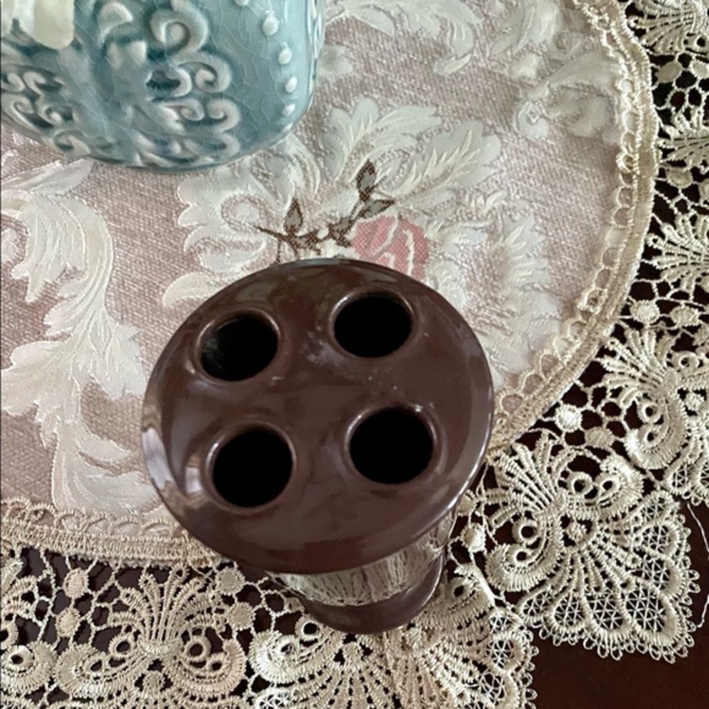 Chocolate brown toothbrush holder.